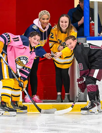 Natalie wearing a jersey and does the ball drop